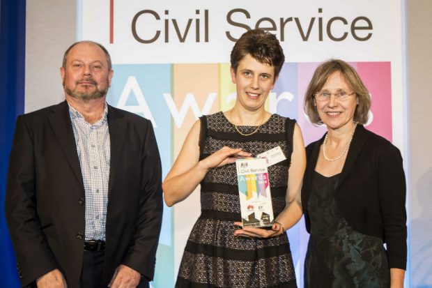 Three people with civil service award 